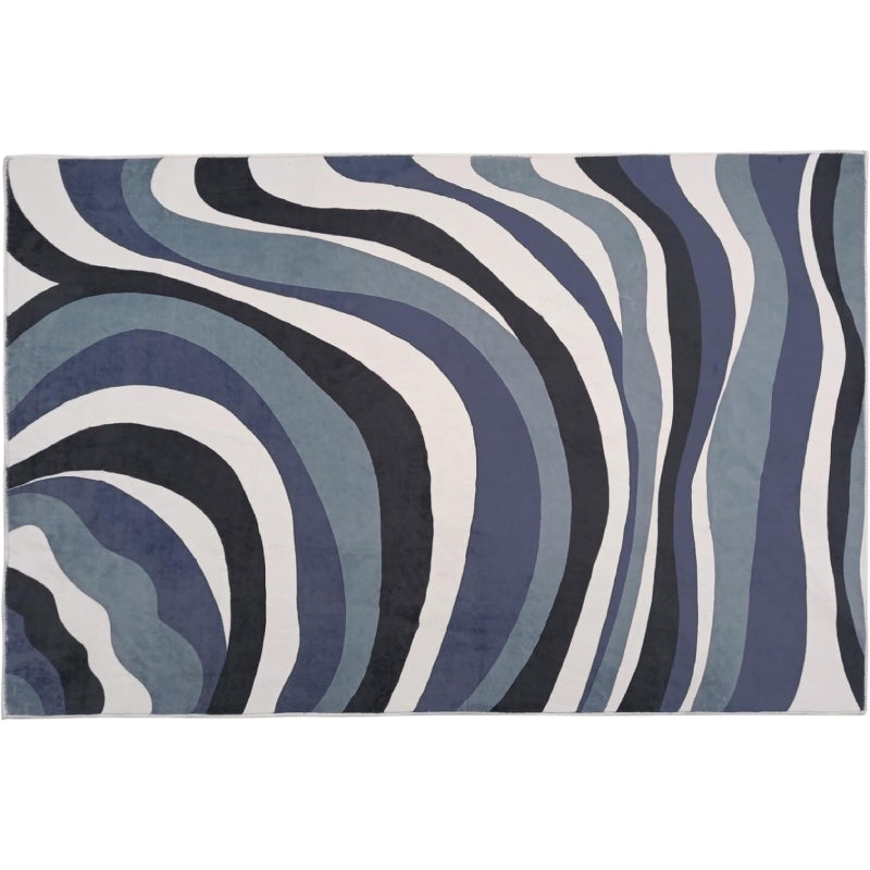 Laundry rug with abstract blue, black, and white wavy line pattern, modern design with a soft textured surface.