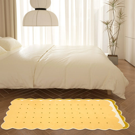 Kids area rug shaped like a biscuit with scalloped edges and dotted details, perfect for playful and cozy spaces.