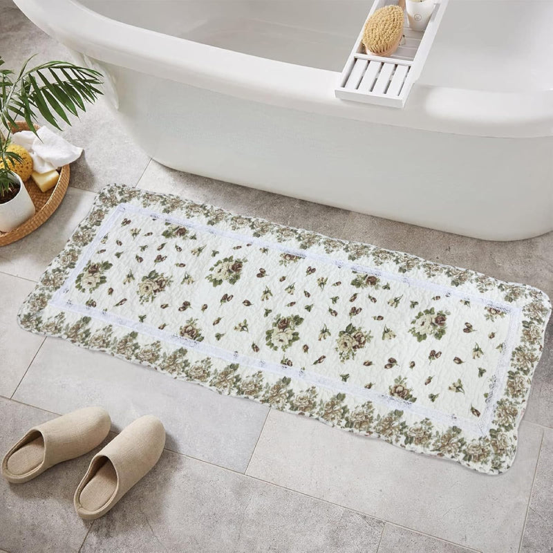 Rectangular living room rug with a white background, featuring a vintage yellow rose floral pattern and a scalloped floral border