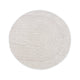 Round beige bathroom rug with a minimalist striped and curved line pattern, placed on a brown floor next to a bathtub, pink towel, and potted plants.