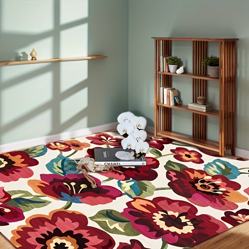 Colorful floral-patterned living room rug with vibrant red, pink, and orange flowers on a white background.