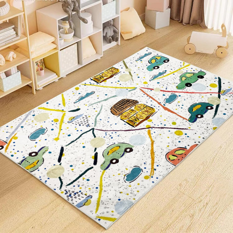 Colorful kids rug with a playful car theme, featuring hand-drawn cars, houses, roads, clouds, and splatter-style background on a white base.