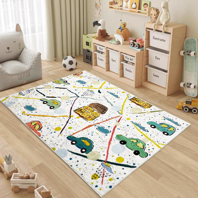 Colorful kids rug with a playful car theme, featuring hand-drawn cars, houses, roads, clouds, and splatter-style background on a white base.