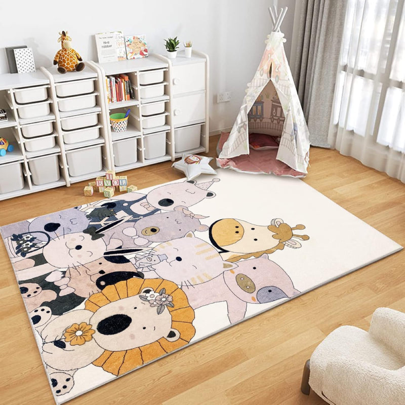 A colorful children's rug featuring a group of cute cartoon animals, including a bear, lion, giraffe, cat, pig, bunny, and others, all smiling and dressed in playful accessories like bows and hats.