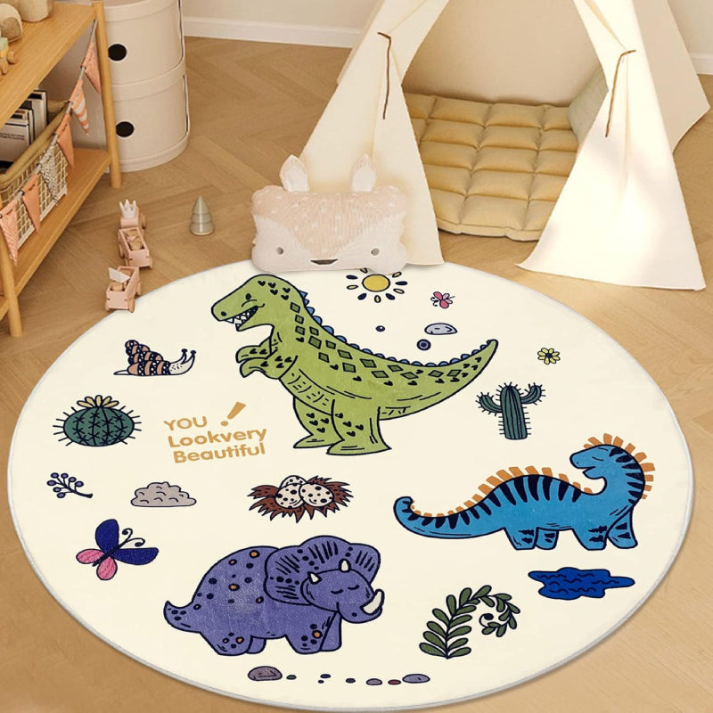 Round children's rug measuring 47.2 inches in diameter, featuring colorful cartoon dinosaurs, plants, butterflies, and eggs on a white background, with the text "YOU! Lookvery Beautiful" printed near the center.