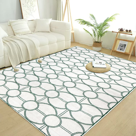 White summer rug with a modern green circular geometric pattern.