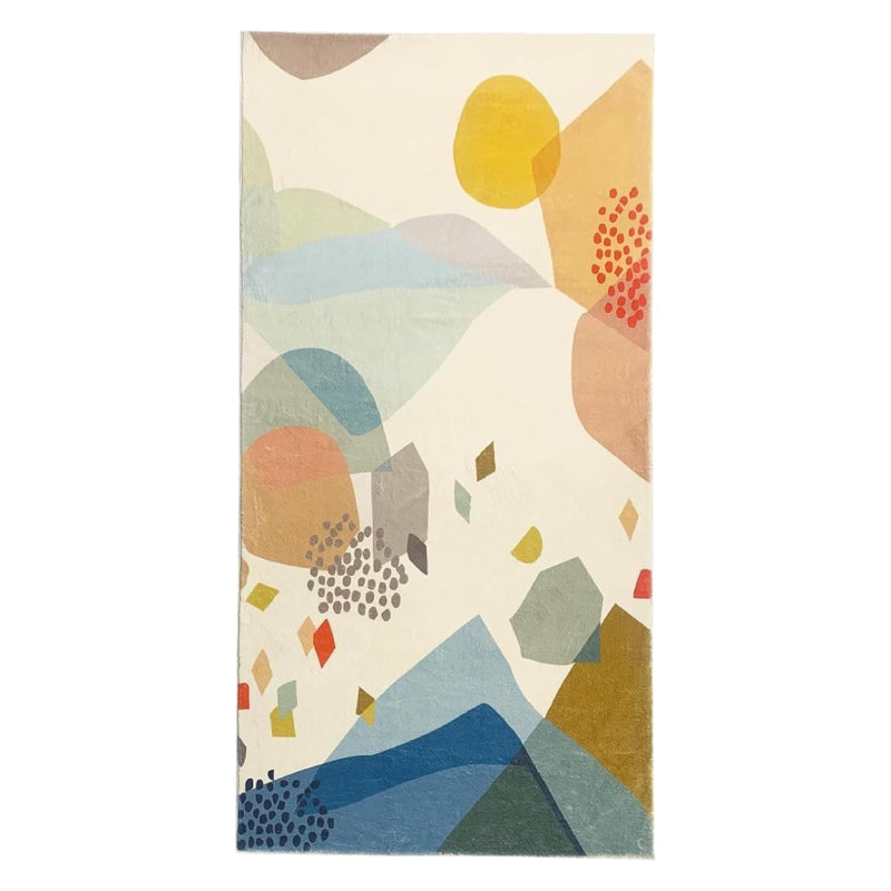 Kids rug with abstract colorful stone pattern in shades of blue, yellow, red, green, and beige on a cream background.