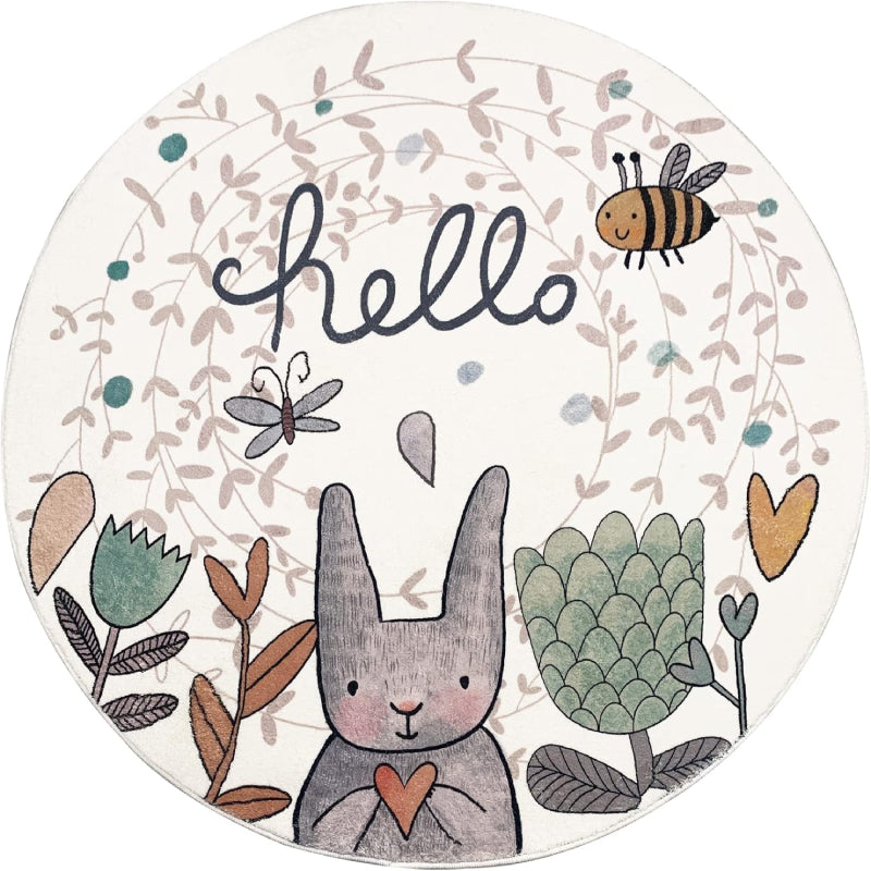 Round children's rug featuring a cute gray Easter bunny holding a heart, surrounded by flowers, a bee, a butterfly, and the word "hello" in playful script on a light background.