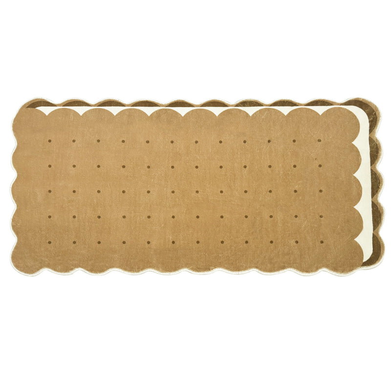 Kids area rug shaped like a biscuit with scalloped edges and dotted details, perfect for playful and cozy spaces.