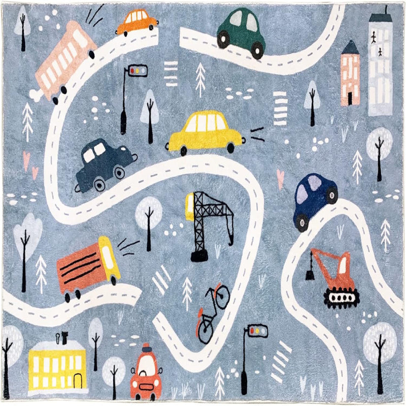 Rectangular kids rug measuring 59 inches by 39.3 inches, featuring a winding town road design with colorful cars, buses, traffic lights, trees, buildings, and construction vehicles on a blue background.