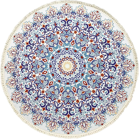 Round bohemian-style rug with an intricate mandala pattern in blue, terracotta, and gold, featuring floral and geometric motifs and finished with fringe tassels around the edge.