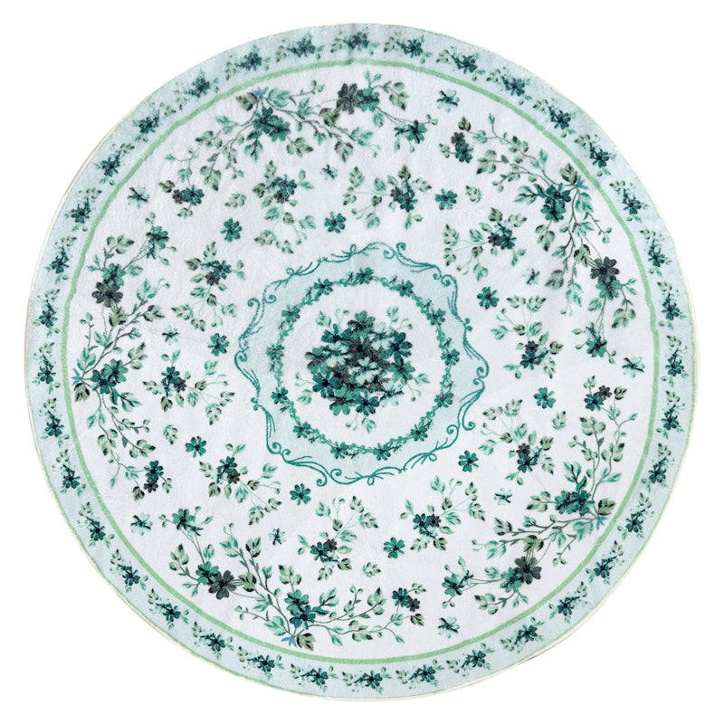 Round boho floral area rug with intricate vintage-style flower patterns and ornamental detailing.