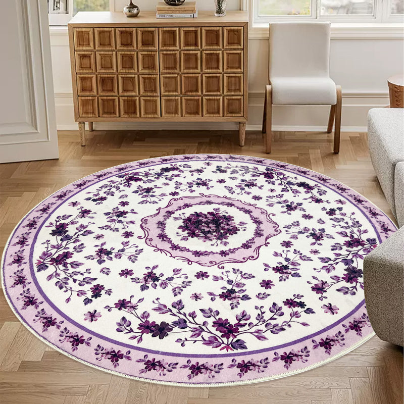 Round boho floral area rug with intricate vintage-style flower patterns and ornamental detailing.