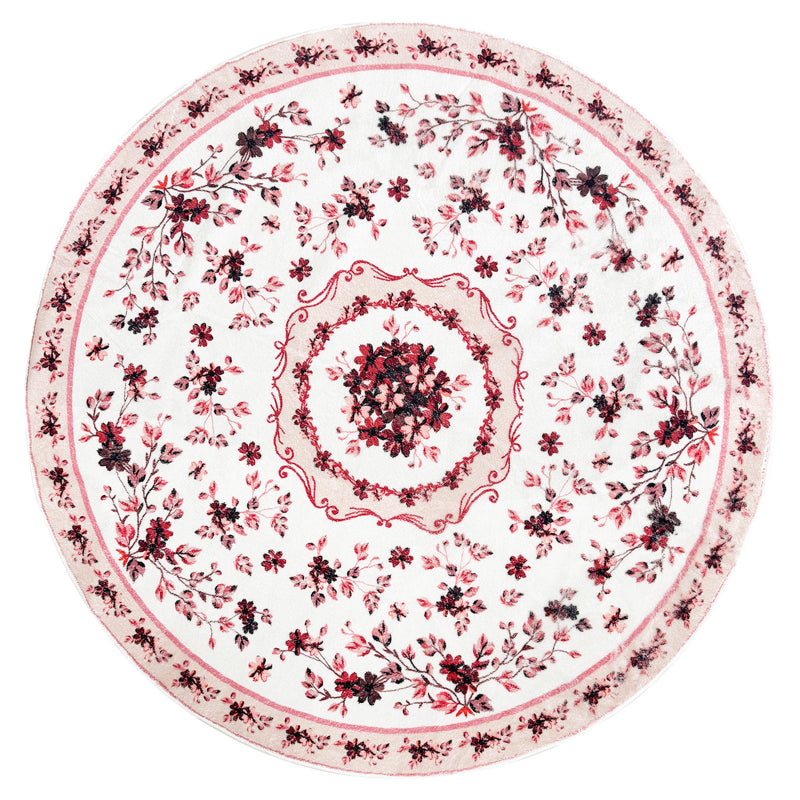 Round boho floral area rug with intricate vintage-style flower patterns and ornamental detailing.