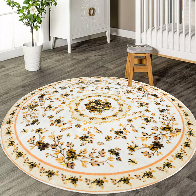 Round boho floral area rug with intricate vintage-style flower patterns and ornamental detailing.