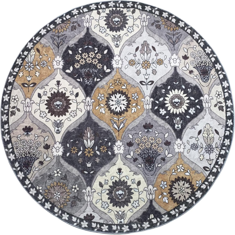 Round vintage floral rug with intricate medallion-style patterns in neutral tones of grey, ivory, and gold.