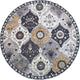 Round vintage floral rug with intricate medallion-style patterns in neutral tones of grey, ivory, and gold.