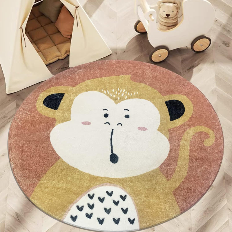 Round children's rug featuring a cute cartoon monkey with a surprised expression, set against a warm brown background.