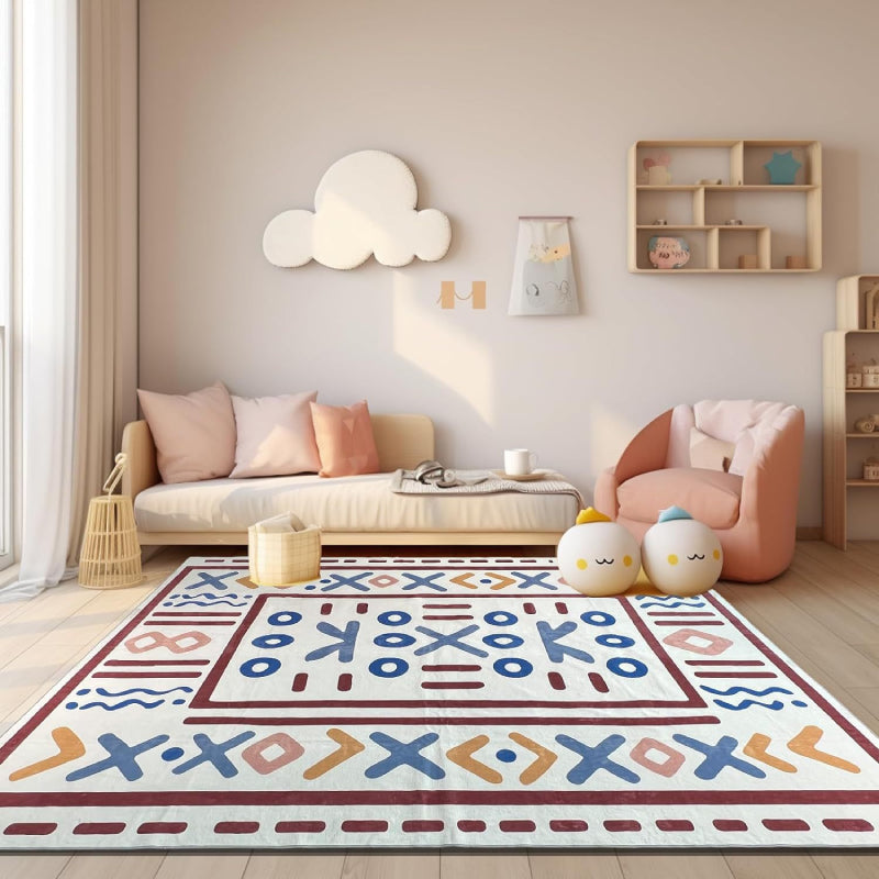 Geometric tribal-style rug with bold symbolic patterns laid in a bright, elegant living room setting.