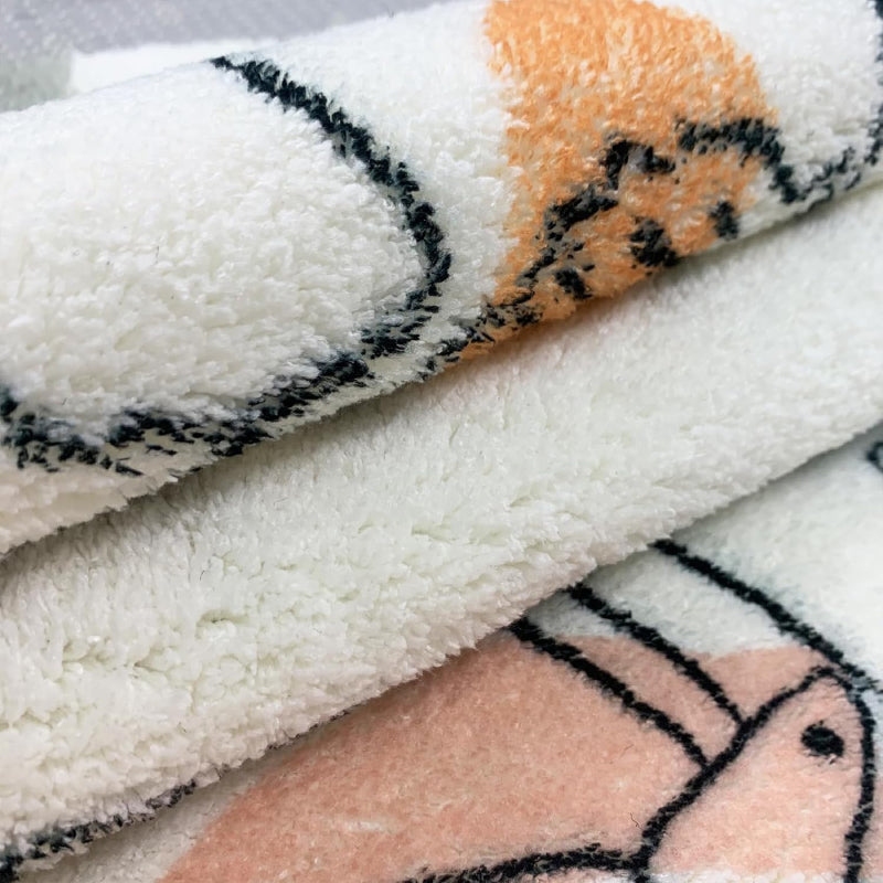 Children's bedroom with a soft rectangular rug featuring hand-drawn animals like giraffes, lions, elephants, and camels in neutral and pastel colors.