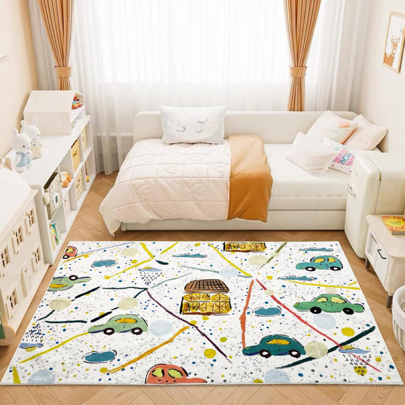 Colorful kids rug with a playful car theme, featuring hand-drawn cars, houses, roads, clouds, and splatter-style background on a white base.