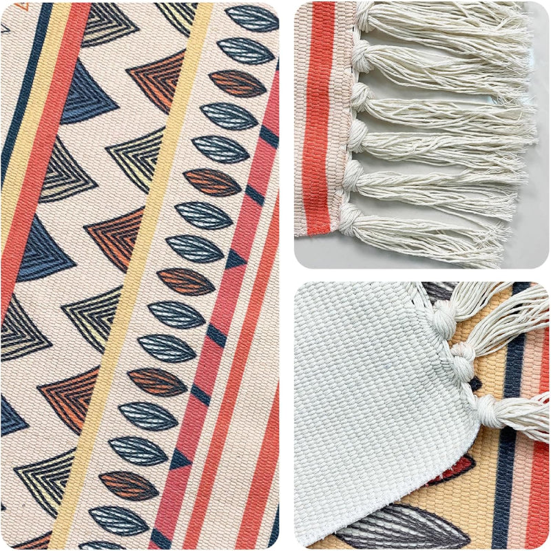 Boho-style handmade rug with colorful geometric and shell patterns, featuring fringe tassels, placed in a bright modern living room with a white sofa, potted plant, and minimalist decor.