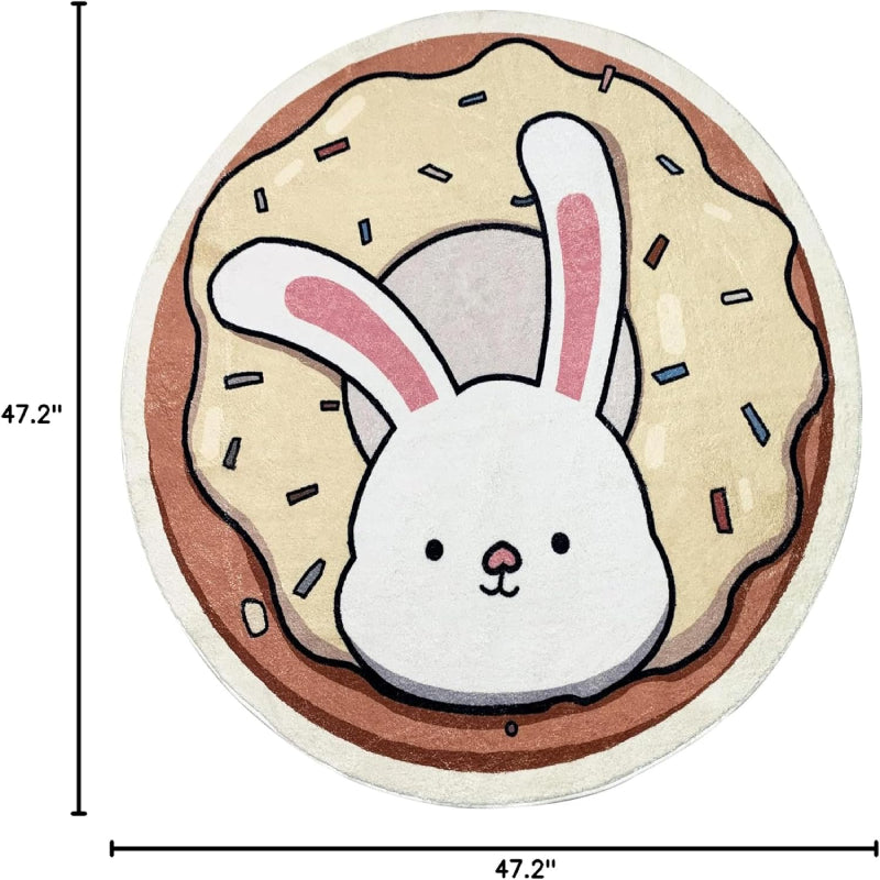 A round children's rug featuring a cute white bunny with pink ears popping out of a donut topped with cream-colored frosting and colorful sprinkles.