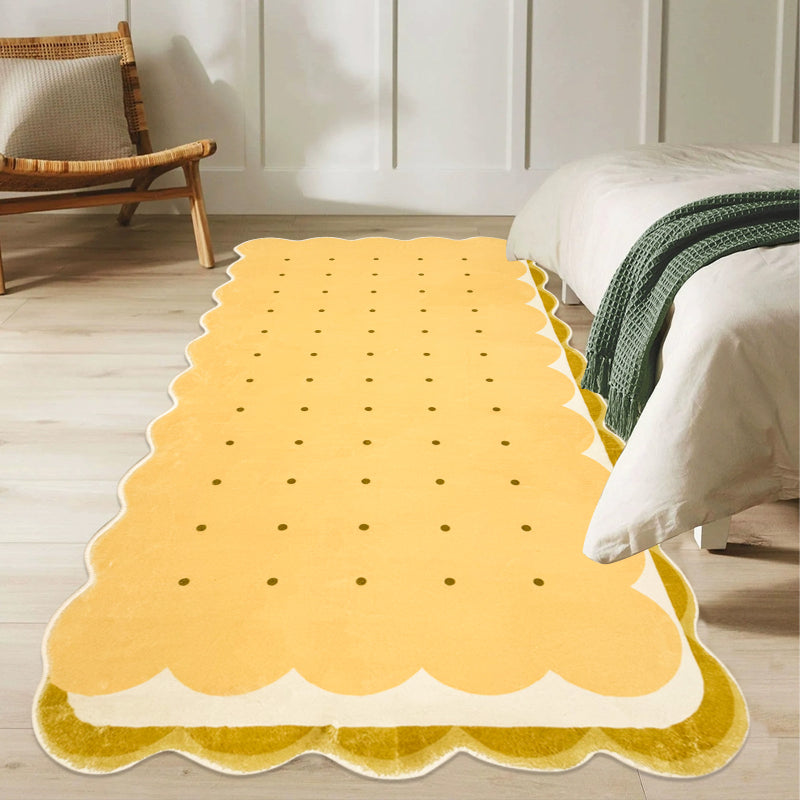Kids area rug shaped like a biscuit with scalloped edges and dotted details, perfect for playful and cozy spaces.