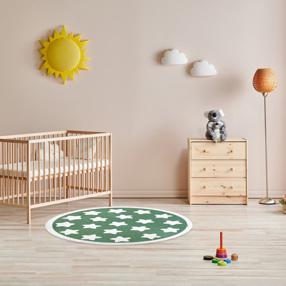 Round kids rug with a playful star pattern, featuring multiple white stars evenly spaced across the surface and bordered by a simple circular edge.