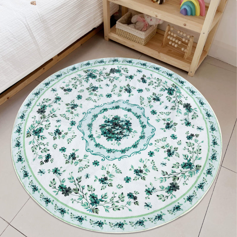 Round boho floral area rug with intricate vintage-style flower patterns and ornamental detailing.