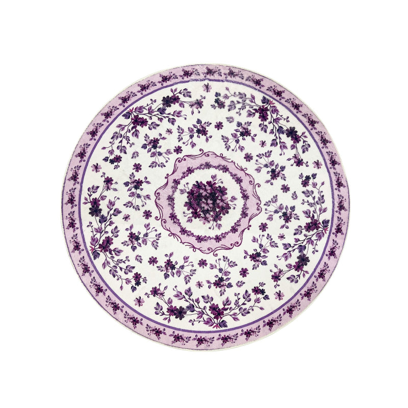 Round boho floral area rug with intricate vintage-style flower patterns and ornamental detailing.