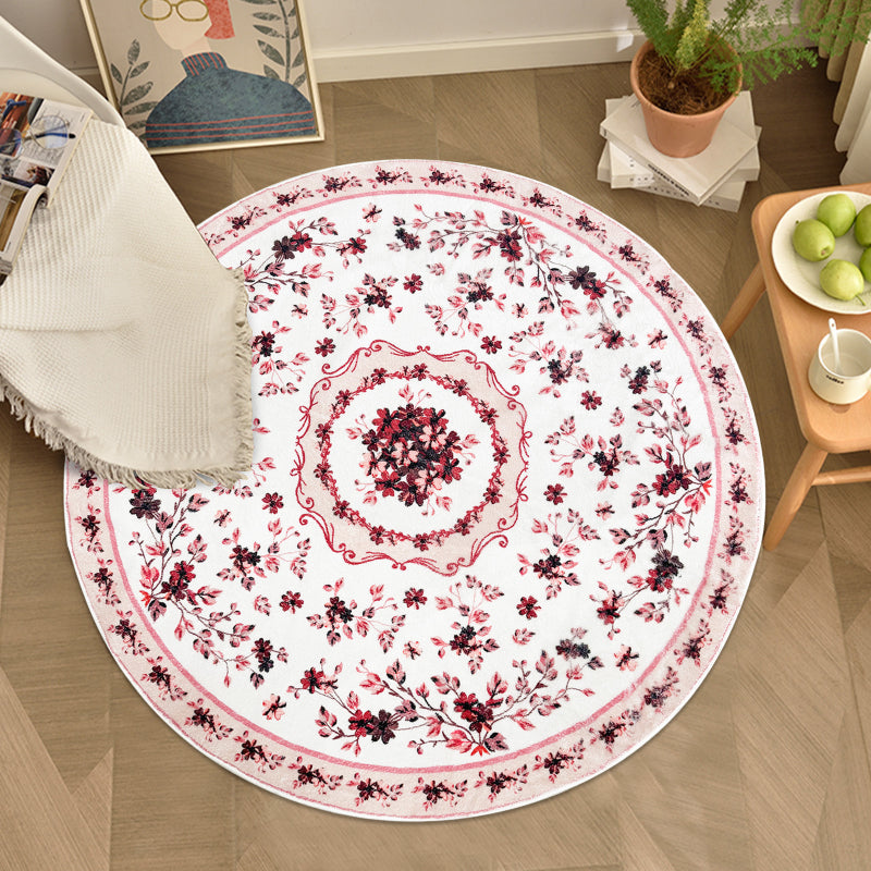 Round boho floral area rug with intricate vintage-style flower patterns and ornamental detailing.