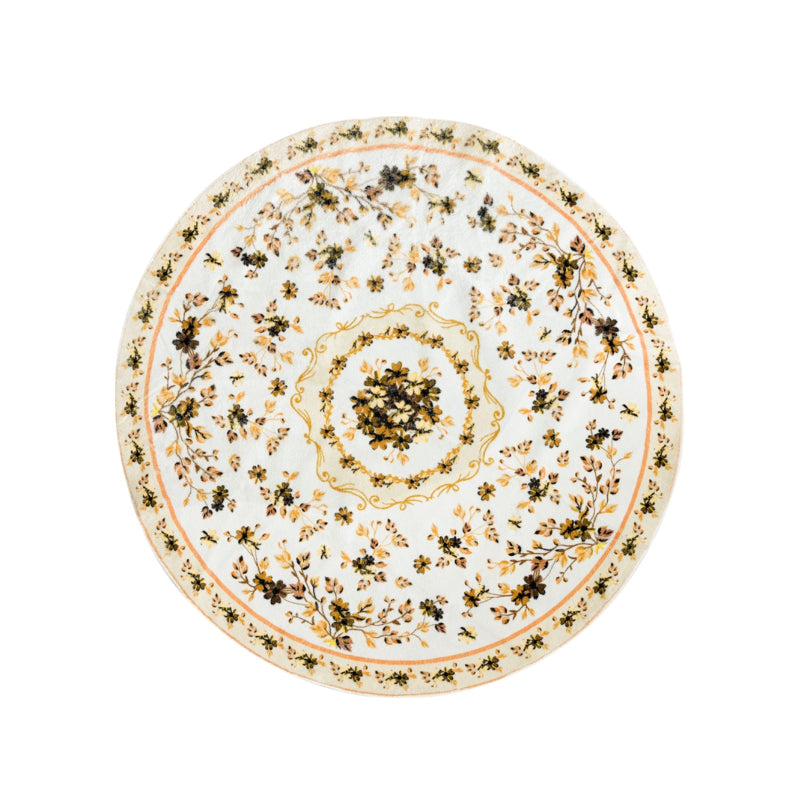 Round boho floral area rug with intricate vintage-style flower patterns and ornamental detailing.