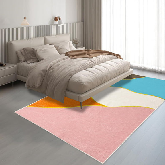 Colorful living room rug with a bright geometric pattern of intersecting triangles in blue, pink, orange, white, and brown, outlined with yellow lines and yellow circular nodes.
