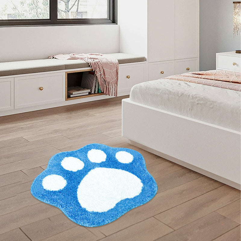 Blue and white paw print bathroom rug made of soft, absorbent microfiber with a non-slip backing.