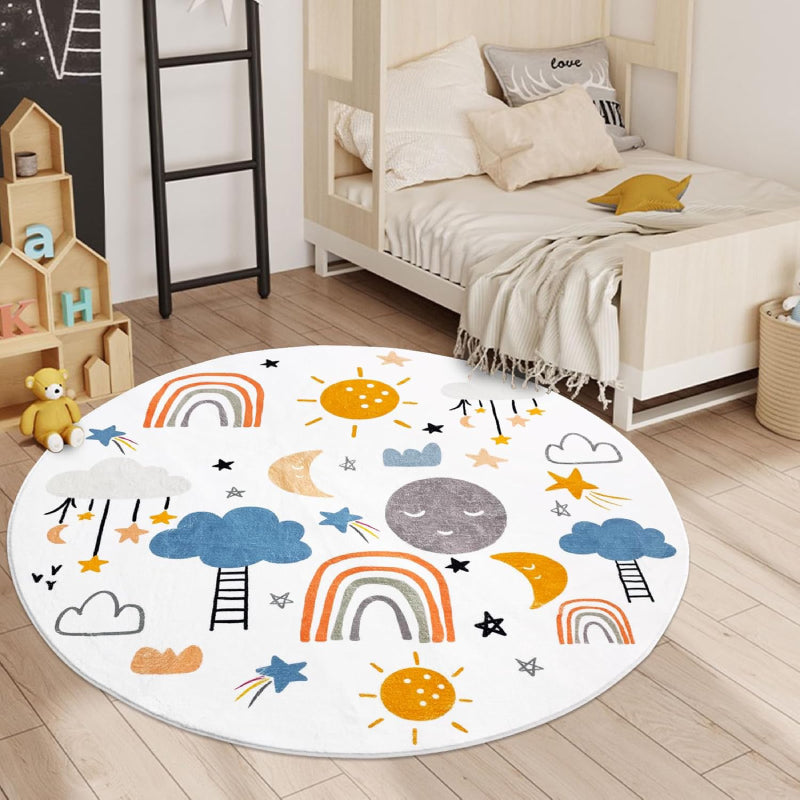 A round kids rug featuring colorful rainbows, smiling suns and moons, clouds, stars, and ladders on a white background. The playful design is ideal for a nursery or playroom.