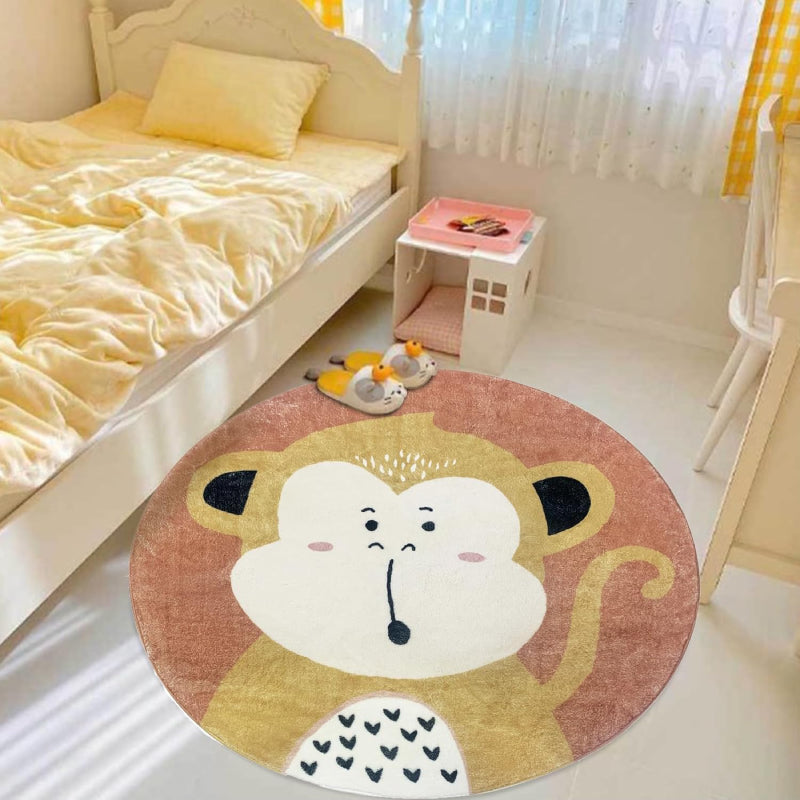 Round children's rug featuring a cute cartoon monkey with a surprised expression, set against a warm brown background.