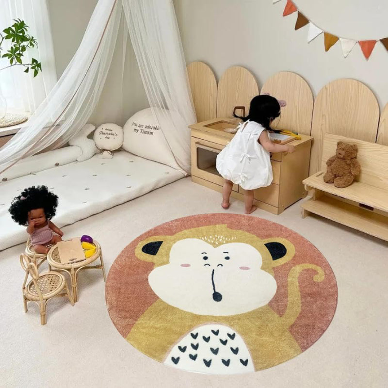 Round children's rug featuring a cute cartoon monkey with a surprised expression, set against a warm brown background.