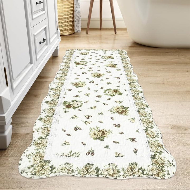 Rectangular living room rug with a white background, featuring a vintage yellow rose floral pattern and a scalloped floral border